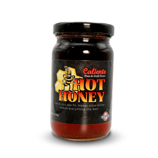 A jar of Caliente Hot Honey, adorned with a sleek black label showcasing a bee, reads: "Use as you see fit. Makes pizza better. Makes everything the best." It's an ideal companion for drizzling on your Pittsburgh Pizza from Caliente Pizza or enjoying with a craft beer at your favorite bar in Pittsburgh.