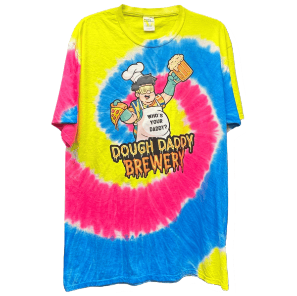 A tie-dye T-shirt with pink, yellow, and blue swirls featuring a cartoon chef holding a pizza and beer, text reads "Dough Daddy Brewery".